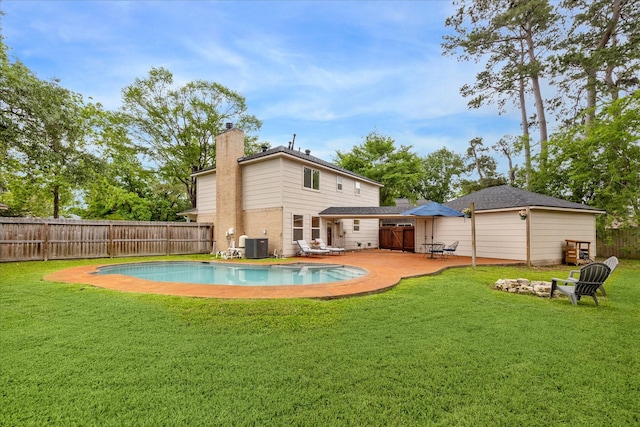rear view of property featuring central AC, a fenced backyard, a fenced in pool, a chimney, and a lawn