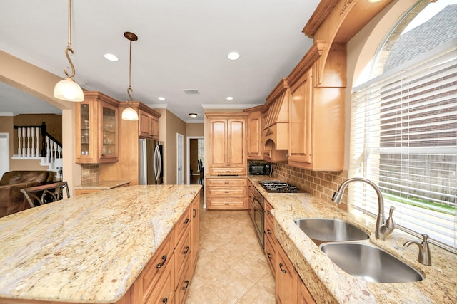 kitchen featuring a sink, appliances with stainless steel finishes, ornamental molding, and backsplash
