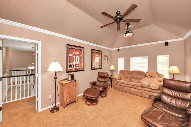 living area featuring light carpet, a ceiling fan, baseboards, lofted ceiling, and ornamental molding