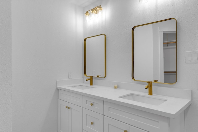 bathroom with double vanity and a sink