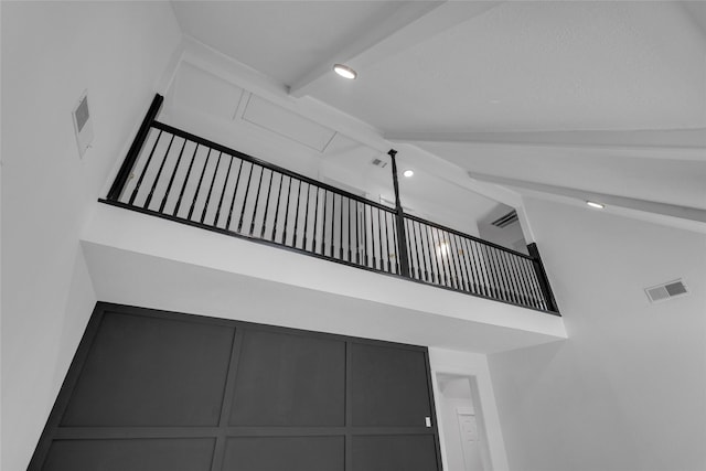 stairs with visible vents, beamed ceiling, recessed lighting, and high vaulted ceiling
