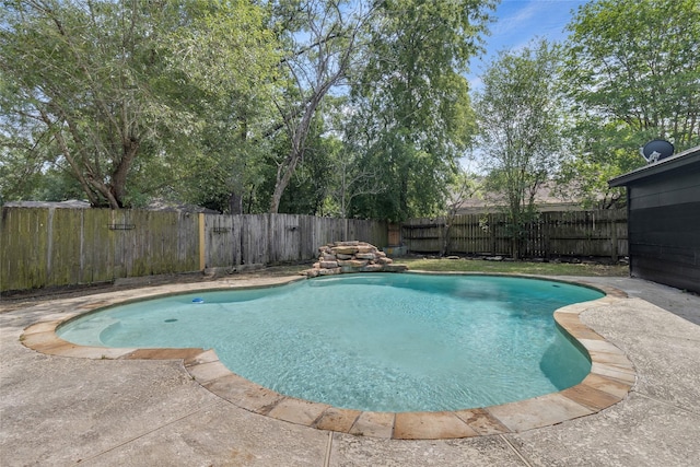 view of pool with a fenced backyard, a patio area, and a fenced in pool
