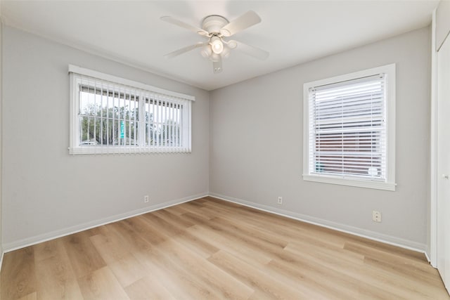 4517 W 43rd St, Houston, TX 77092 - empty room featuring light wood finished floors, a ceiling fan, and baseboards