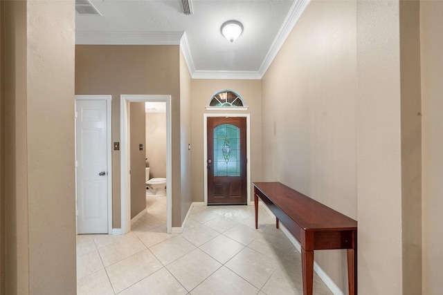 15015 Cozy Hollow Ln, Houston, TX 77044 - foyer entrance with crown molding, light tile patterned floors, and baseboards