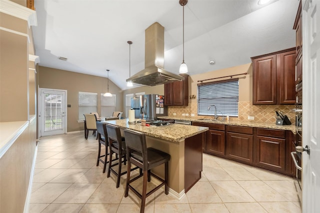 15015 Cozy Hollow Ln, Houston, TX 77044 - kitchen with island range hood, light tile patterned floors, decorative backsplash, lofted ceiling, and a kitchen breakfast bar
