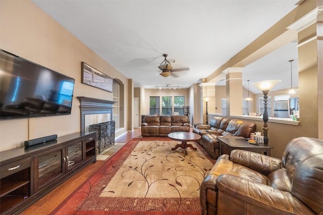 15015 Cozy Hollow Ln, Houston, TX 77044 - living area featuring a ceiling fan, dark wood-style flooring, and a high end fireplace