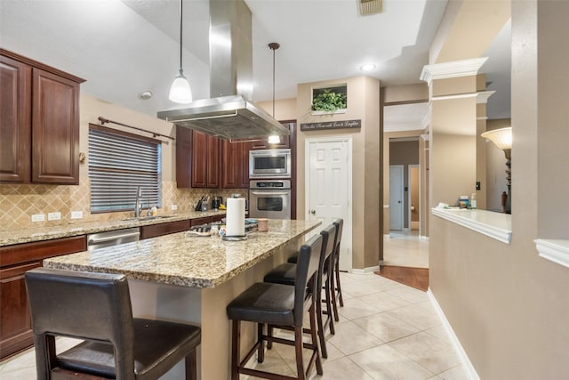 kitchen with island range hood, appliances with stainless steel finishes, backsplash, a sink, and visible vents