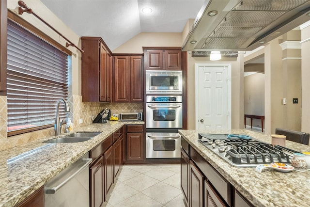 15015 Cozy Hollow Ln, Houston, TX 77044 - kitchen with appliances with stainless steel finishes, a sink, range hood, arched walkways, and decorative backsplash