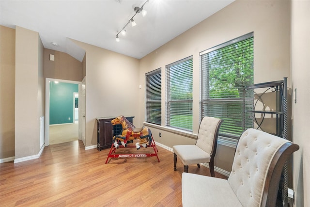 15015 Cozy Hollow Ln, Houston, TX 77044 - living area featuring wood finished floors, baseboards, and track lighting