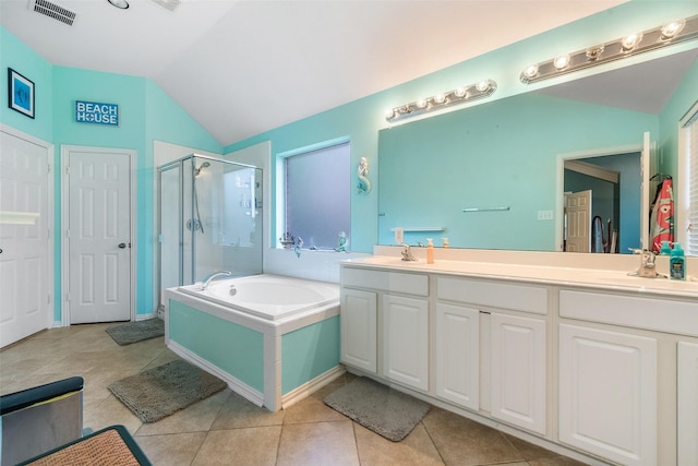 15015 Cozy Hollow Ln, Houston, TX 77044 - full bathroom featuring a stall shower, a garden tub, vaulted ceiling, double vanity, and tile patterned floors