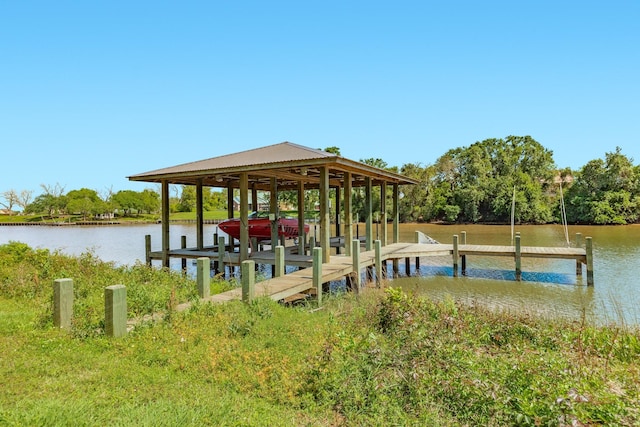dock area featuring boat lift and a water view