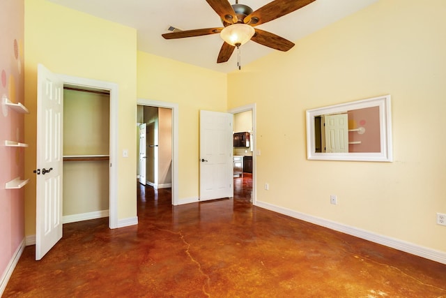 unfurnished bedroom with baseboards, a ceiling fan, finished concrete flooring, and a closet
