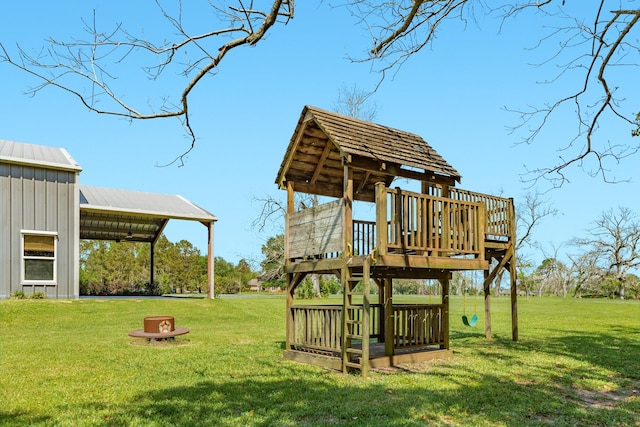 view of jungle gym with a lawn