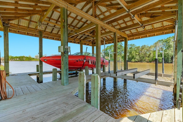 view of dock featuring a water view and boat lift