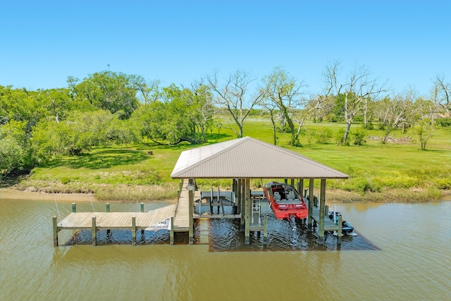 dock area with a yard, a water view, and boat lift