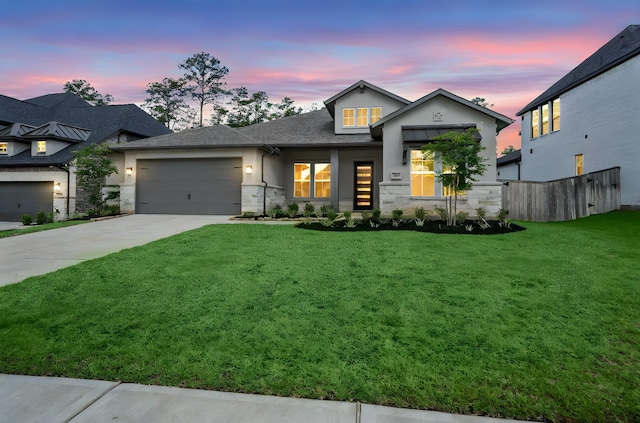 1222 Tallow Park Ln, Pinehurst, TX 77362 - view of front facade with an attached garage, driveway, stucco siding, and stone siding