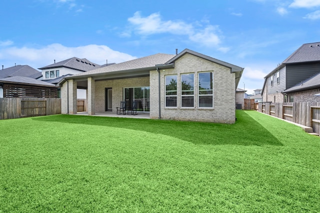 1222 Tallow Park Ln, Pinehurst, TX 77362 - rear view of property with a patio, brick siding, and roof with shingles