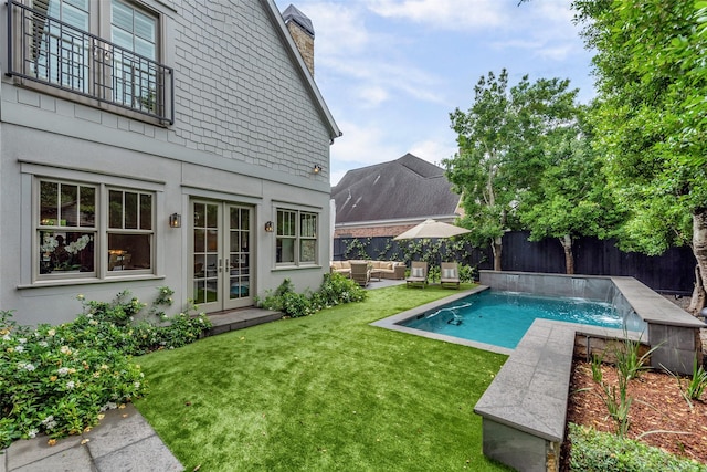 4020 Sul Ross St, Houston, TX 77027 - view of swimming pool featuring an outdoor living space, a fenced in pool, a fenced backyard, a lawn, and french doors