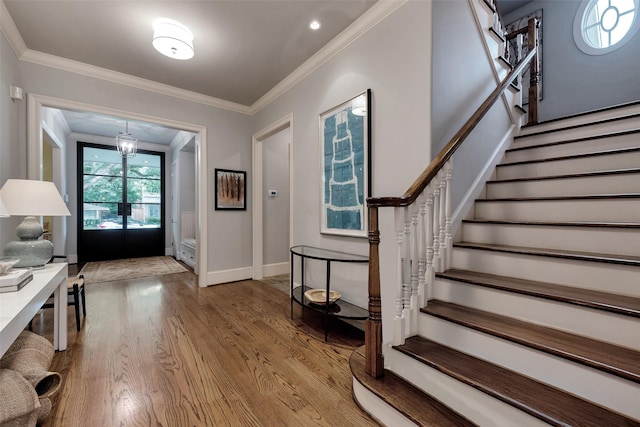 4020 Sul Ross St, Houston, TX 77027 - foyer entrance with baseboards, wood finished floors, stairs, and crown molding