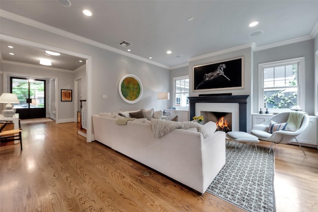 4020 Sul Ross St, Houston, TX 77027 - living area with recessed lighting, visible vents, a lit fireplace, and light wood-type flooring