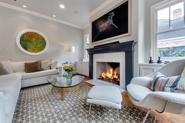 4020 Sul Ross St, Houston, TX 77027 - living room featuring ornamental molding, recessed lighting, a fireplace with flush hearth, and wood finished floors