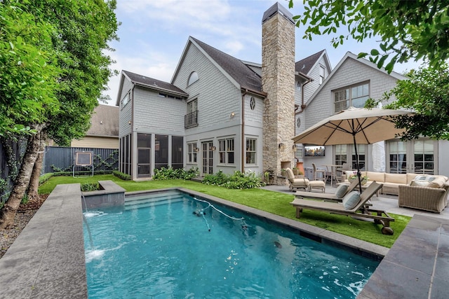 4020 Sul Ross St, Houston, TX 77027 - back of property featuring a sunroom, a patio area, a fenced in pool, outdoor lounge area, and fence