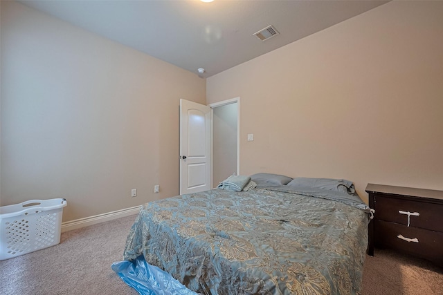 bedroom featuring baseboards, visible vents, and carpet flooring