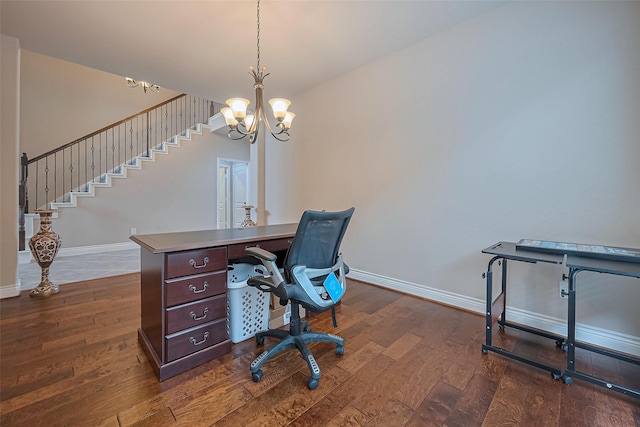 office featuring baseboards, an inviting chandelier, and dark wood finished floors