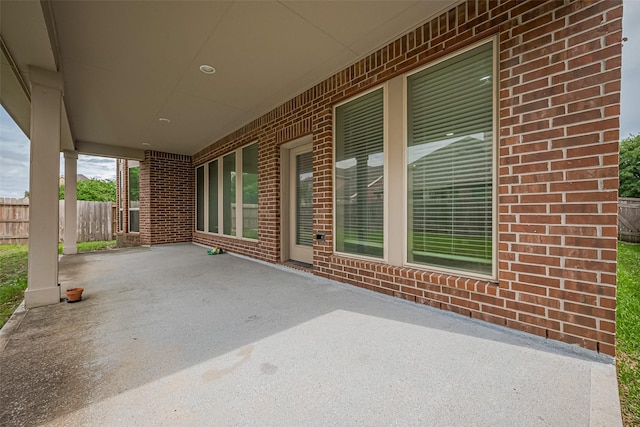 view of patio featuring fence