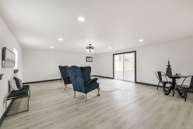 sitting room featuring baseboards, recessed lighting, and light wood-type flooring
