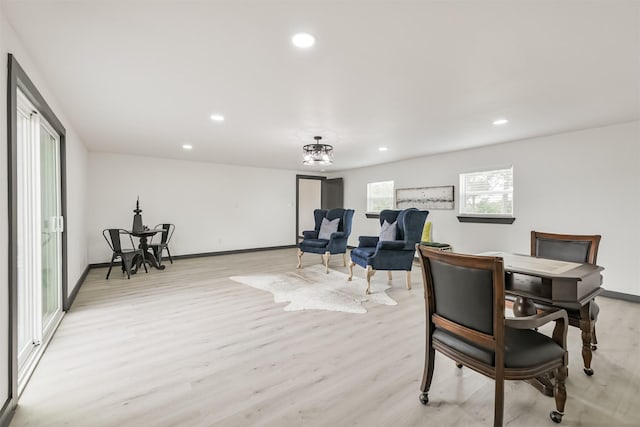 dining area with baseboards, recessed lighting, and light wood finished floors