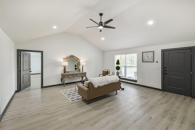 bedroom featuring lofted ceiling, light wood finished floors, and baseboards