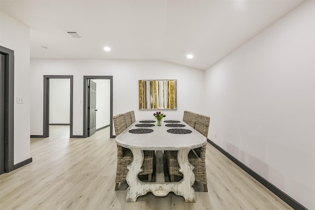 dining area with recessed lighting, light wood-type flooring, visible vents, vaulted ceiling, and baseboards