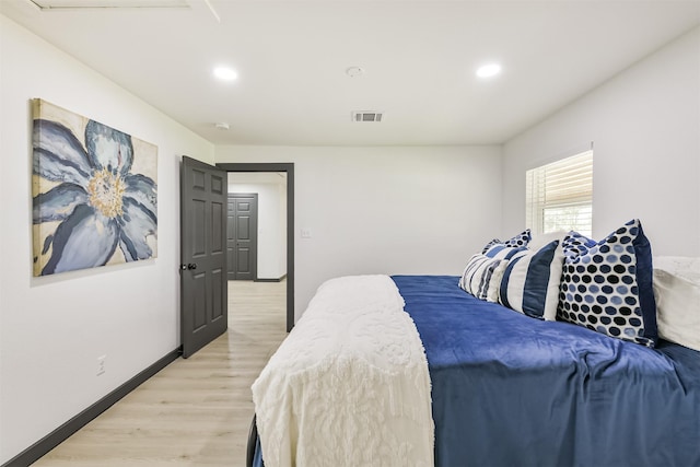 bedroom with visible vents, light wood-type flooring, recessed lighting, and baseboards