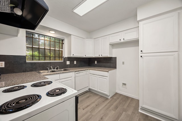 kitchen featuring white cabinetry, white appliances, and a sink