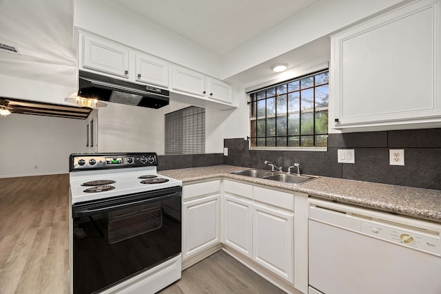 kitchen with range with electric cooktop, under cabinet range hood, white cabinets, dishwasher, and a sink