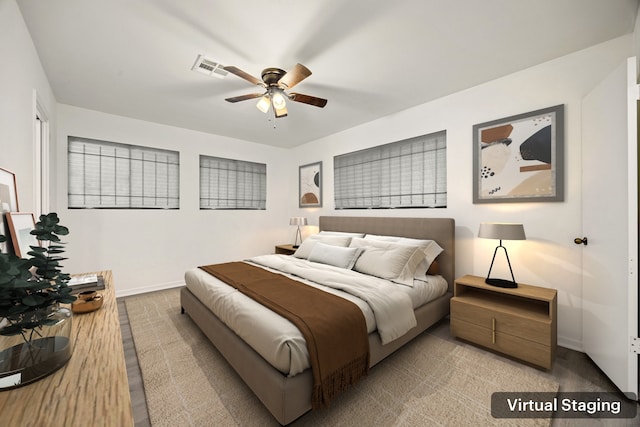 bedroom featuring visible vents, ceiling fan, and baseboards