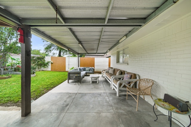 view of patio / terrace featuring an outdoor living space and fence