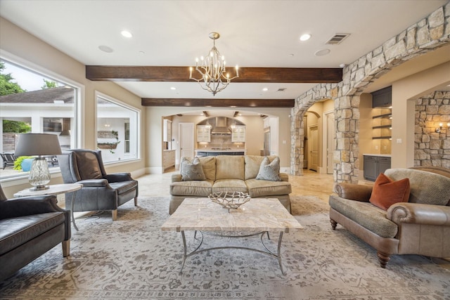 living area with recessed lighting, arched walkways, a chandelier, and visible vents