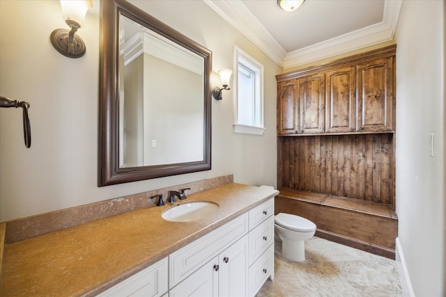 bathroom featuring crown molding, vanity, and toilet