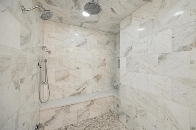 full bathroom featuring tiled shower