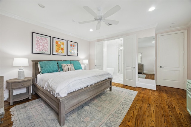 bedroom with recessed lighting, ornamental molding, ensuite bath, and wood finished floors
