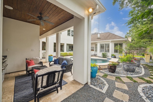 view of patio / terrace featuring ceiling fan, an outdoor living space, and an outdoor pool