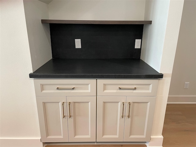 details with wood finished floors and baseboards