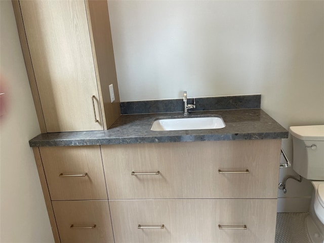 half bathroom featuring toilet and a sink