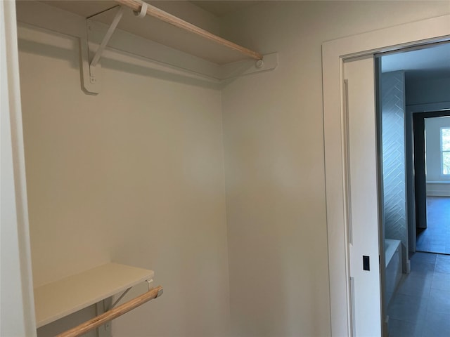 spacious closet with tile patterned flooring