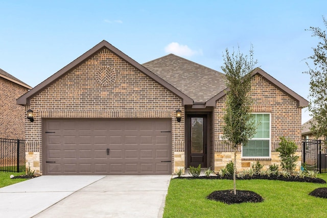 ranch-style house featuring a front lawn, a garage, driveway, brick siding, and fence