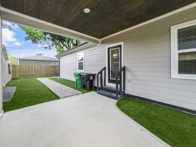 view of patio featuring fence and entry steps