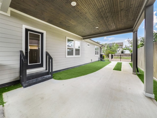 view of patio / terrace featuring entry steps and fence