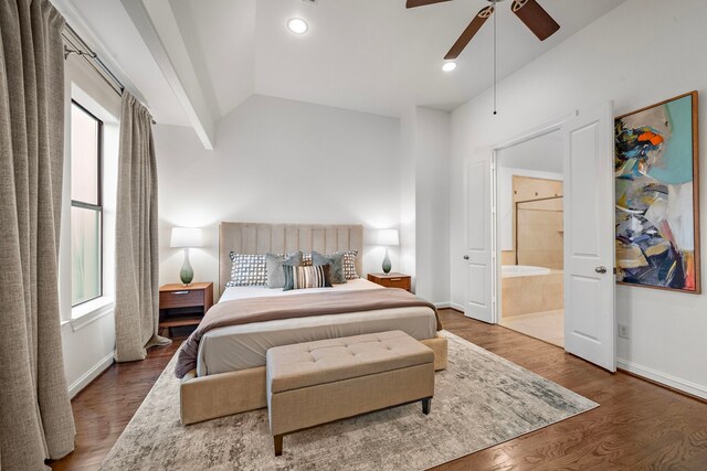 bedroom with baseboards, vaulted ceiling, and multiple windows